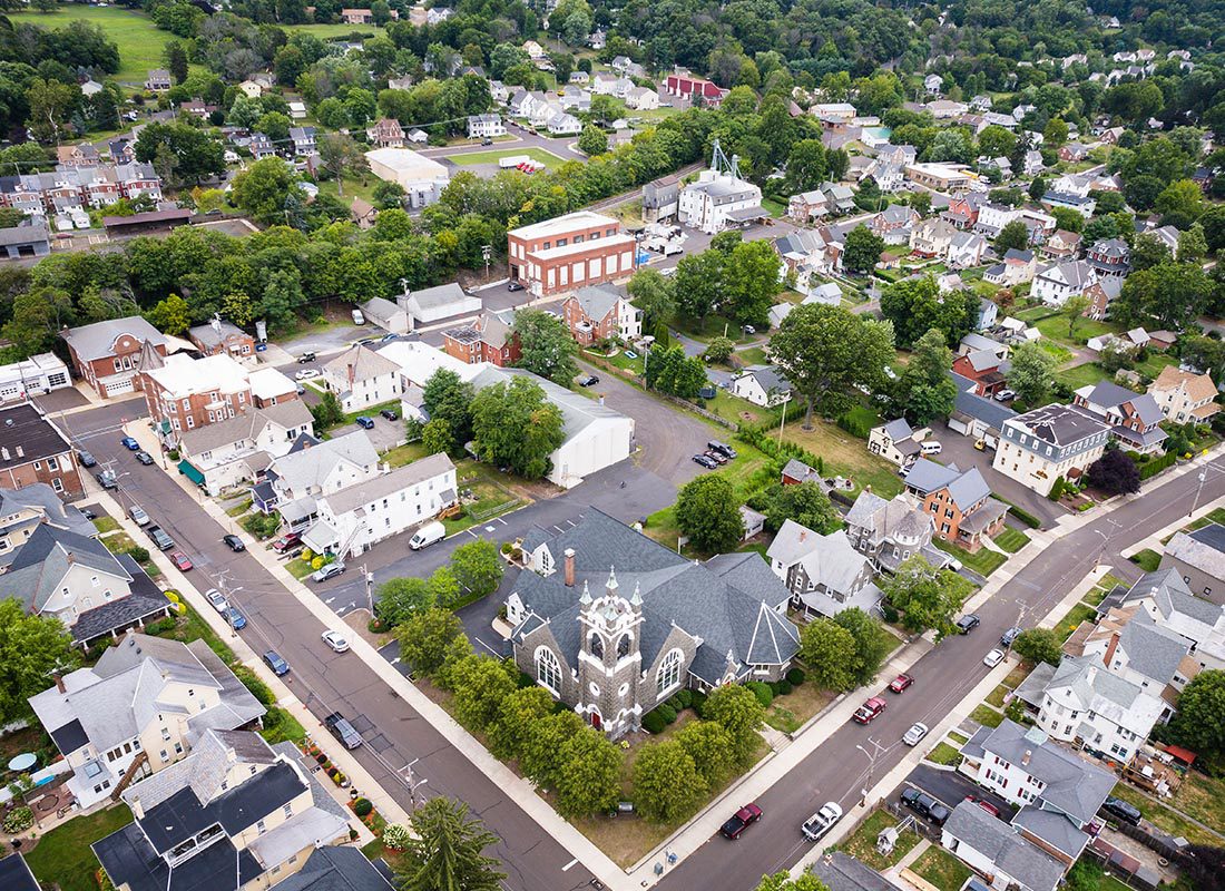 Furlong, PA - Aerial View of Homes in Perkasie Pennsylvania Displaying Many Buildings and Trees on a Sunny Day